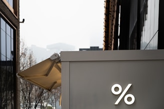 a large umbrella is on the side of a building