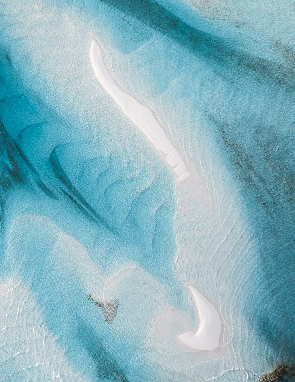 a bird's eye view of the water and sand
