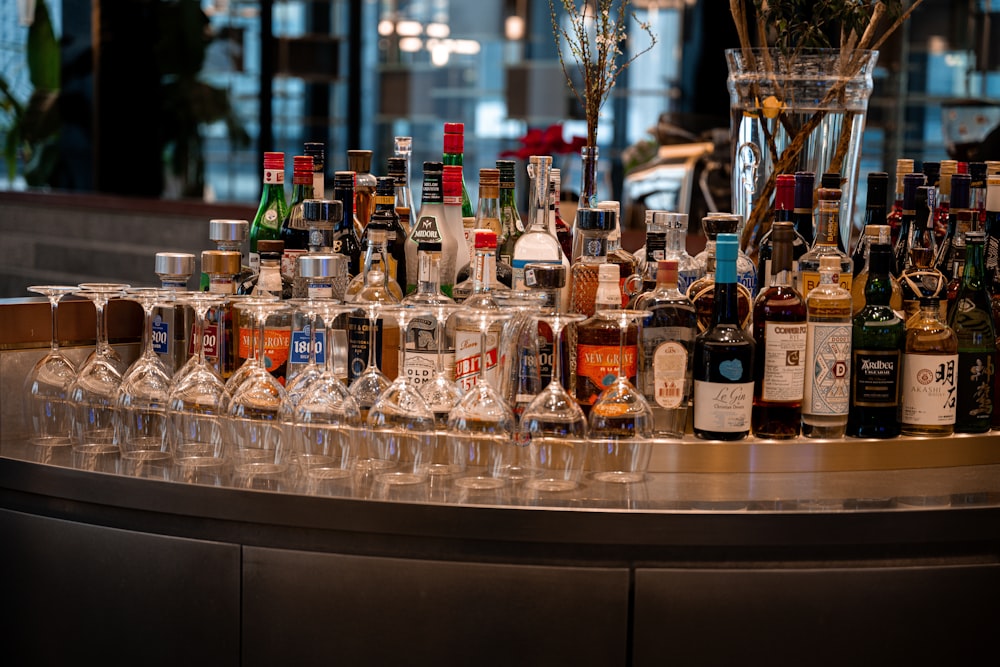a bar filled with lots of bottles and glasses