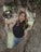 a woman standing in the middle of a tree