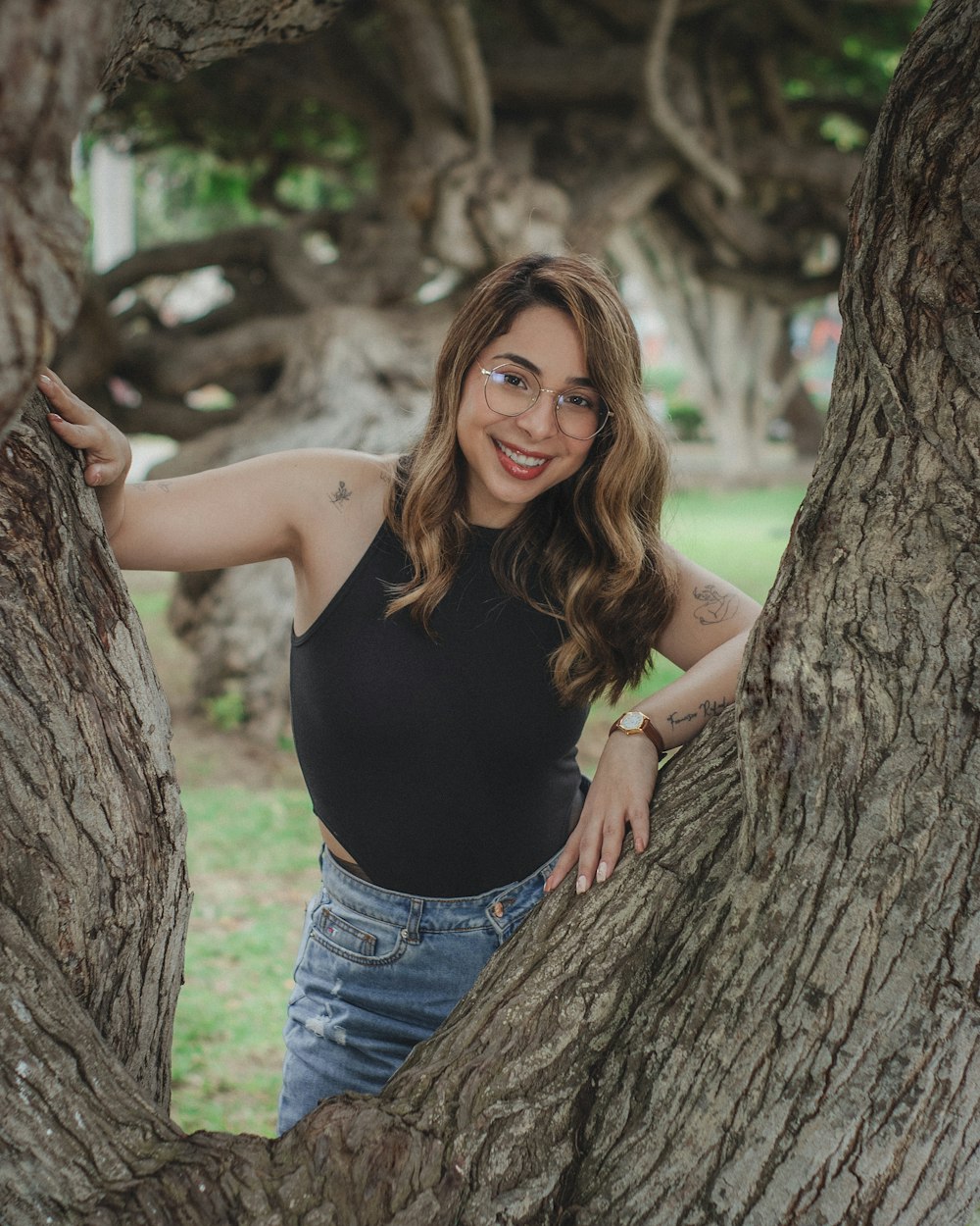 a woman standing in the middle of a tree