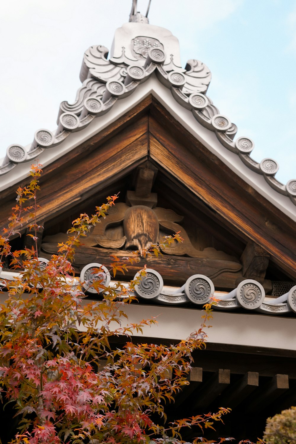 a close up of a roof with a clock on it