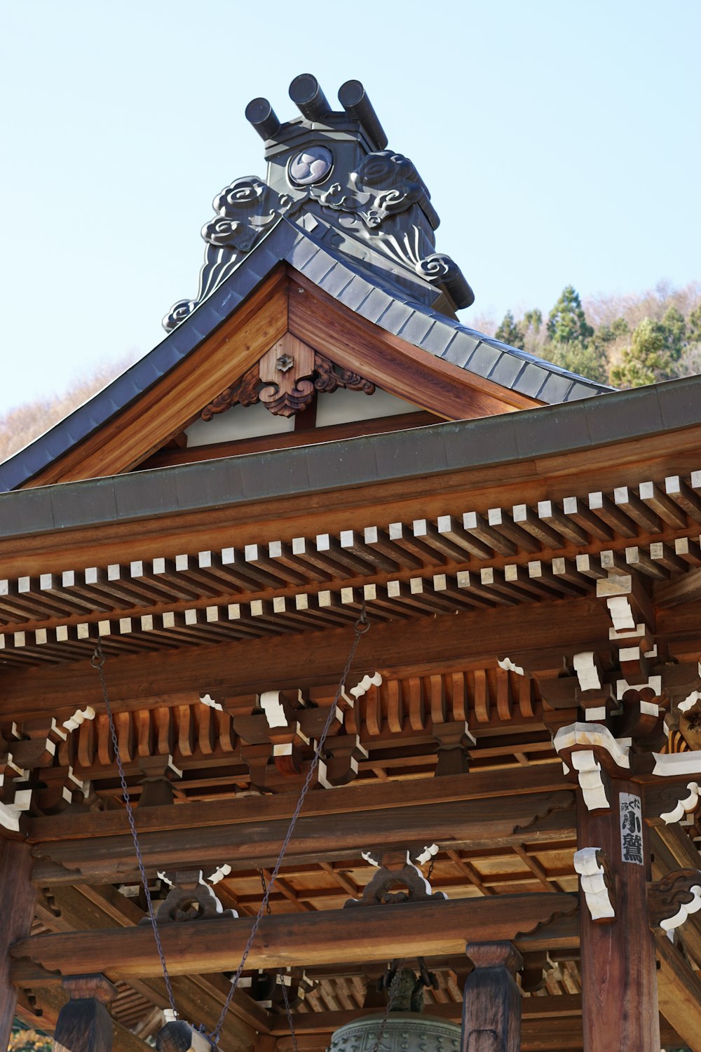 a bell on top of a wooden structure