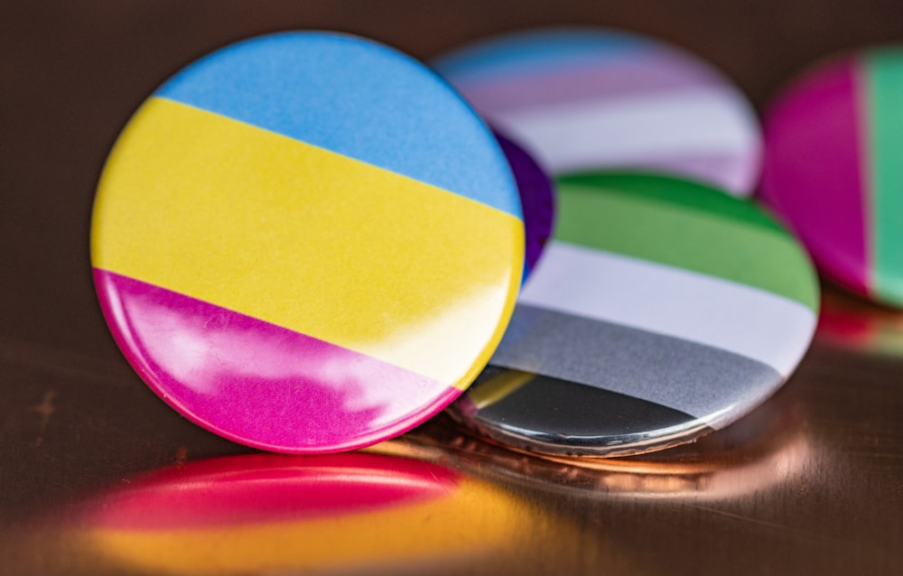 a close up of three buttons on a table