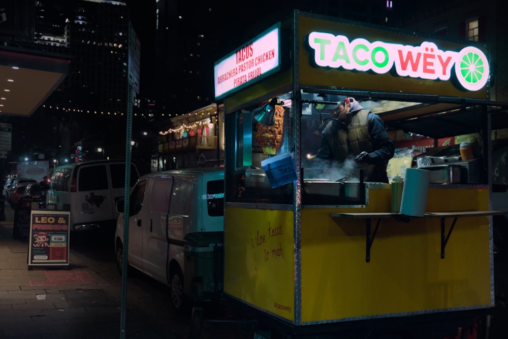 a taco truck parked on the side of a street