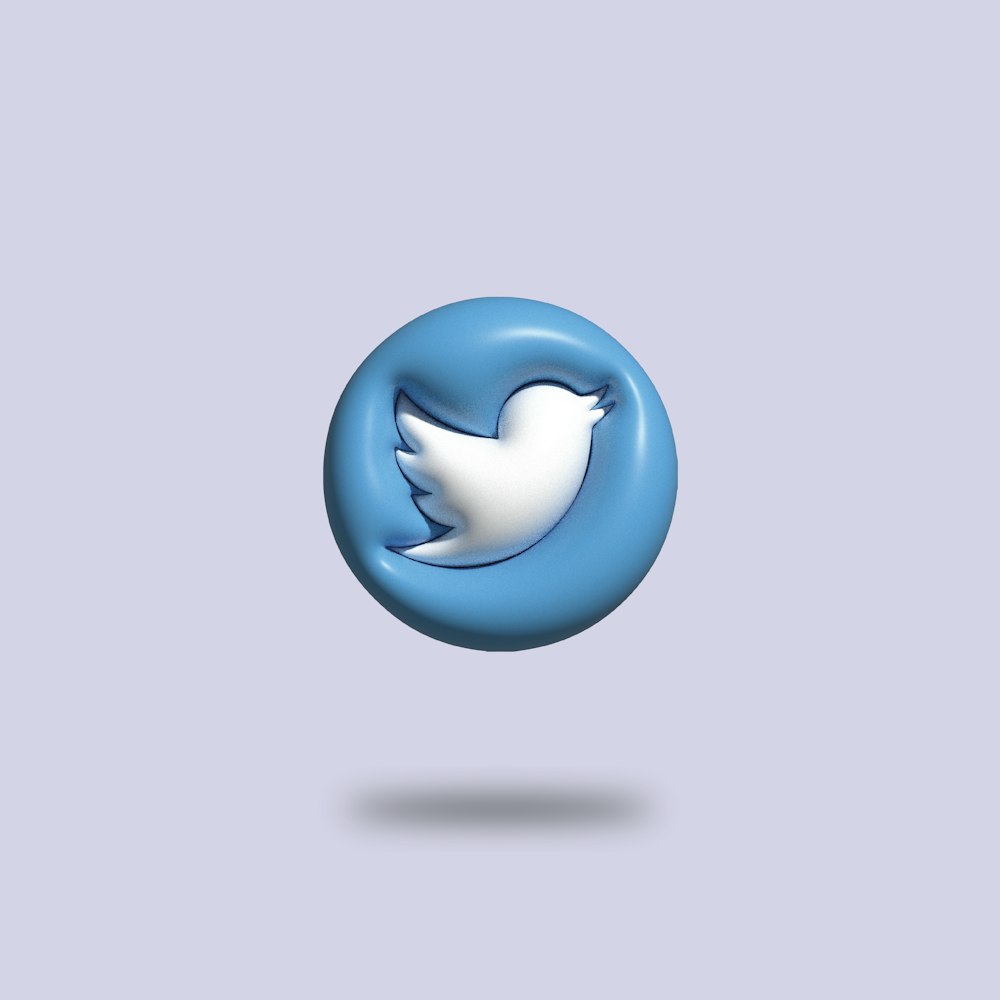 a blue and white twitter logo on a gray background