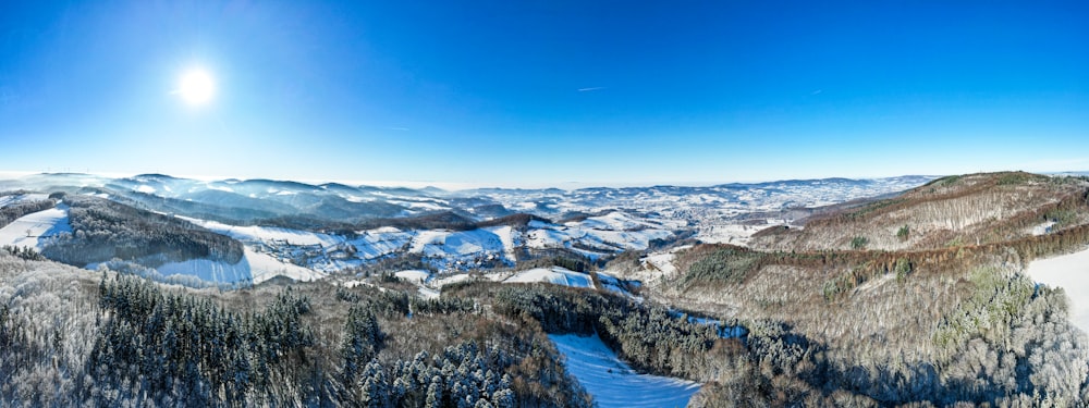 a view of a snowy mountain range from a ski lift