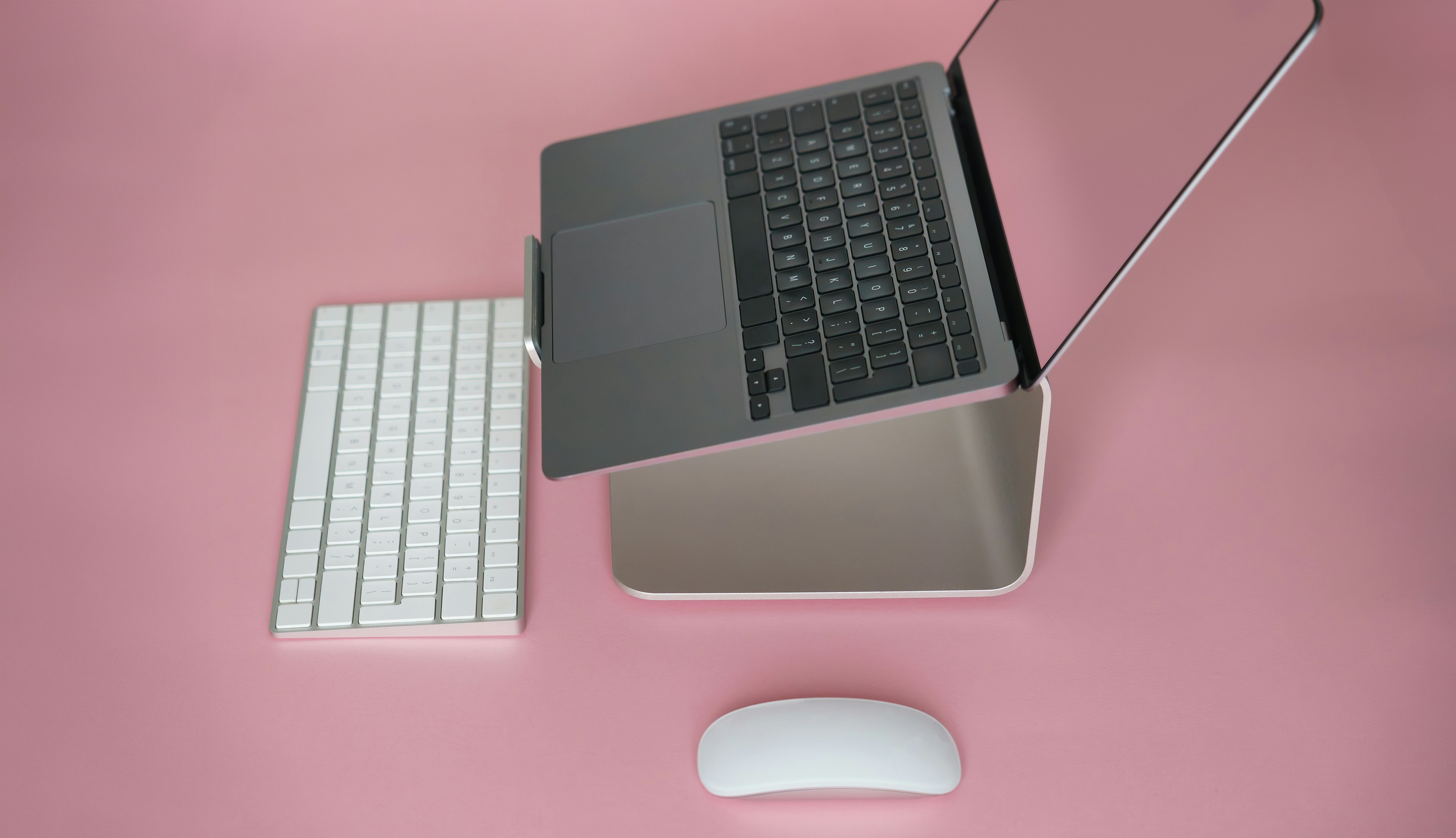 3D rendered minimalist spherical digital character on glass desk stand