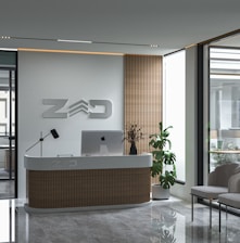 a reception desk with a laptop on top of it