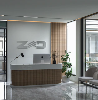 a reception desk with a laptop on top of it