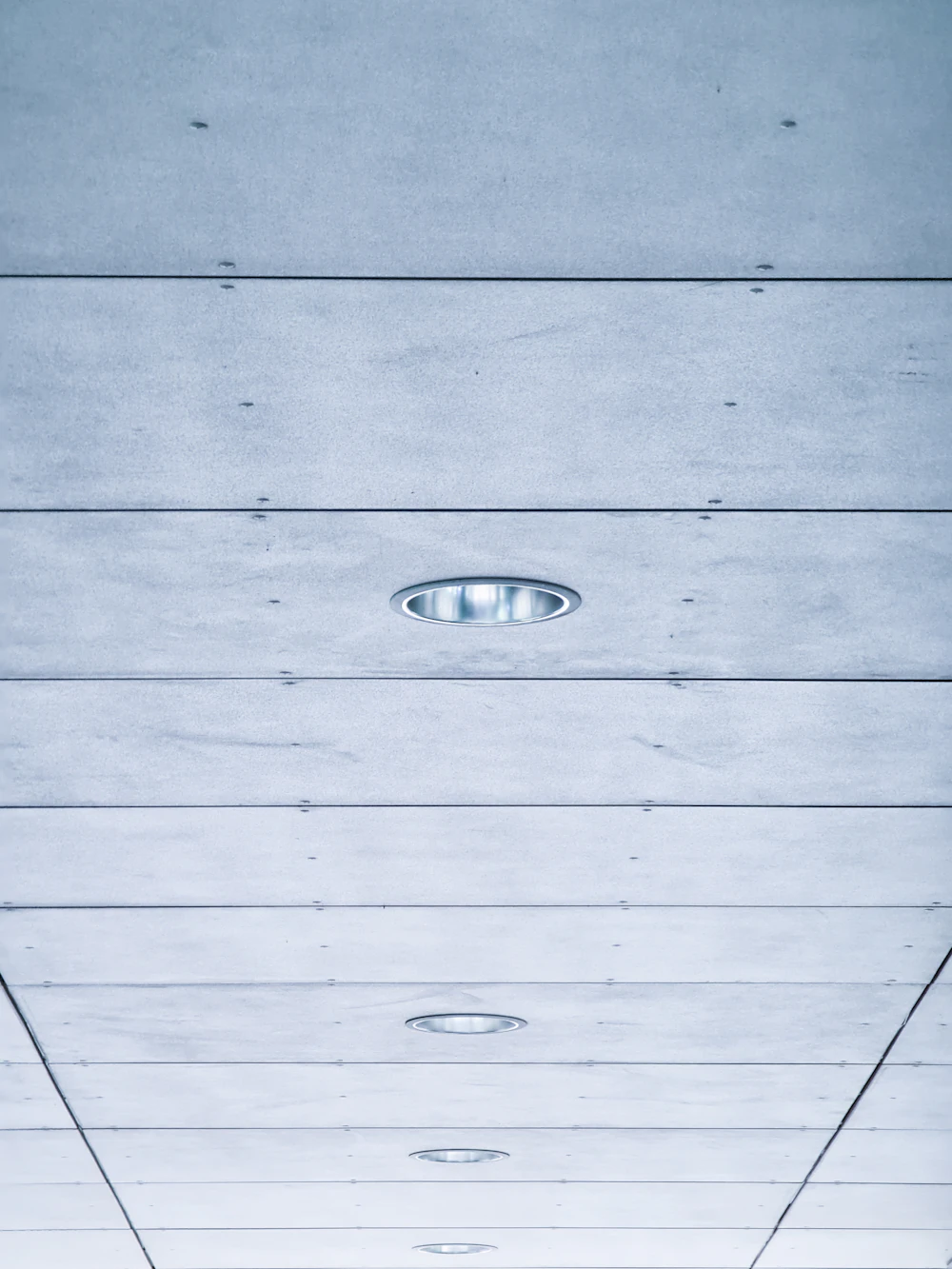 Long hallway with a wood-plank ceiling