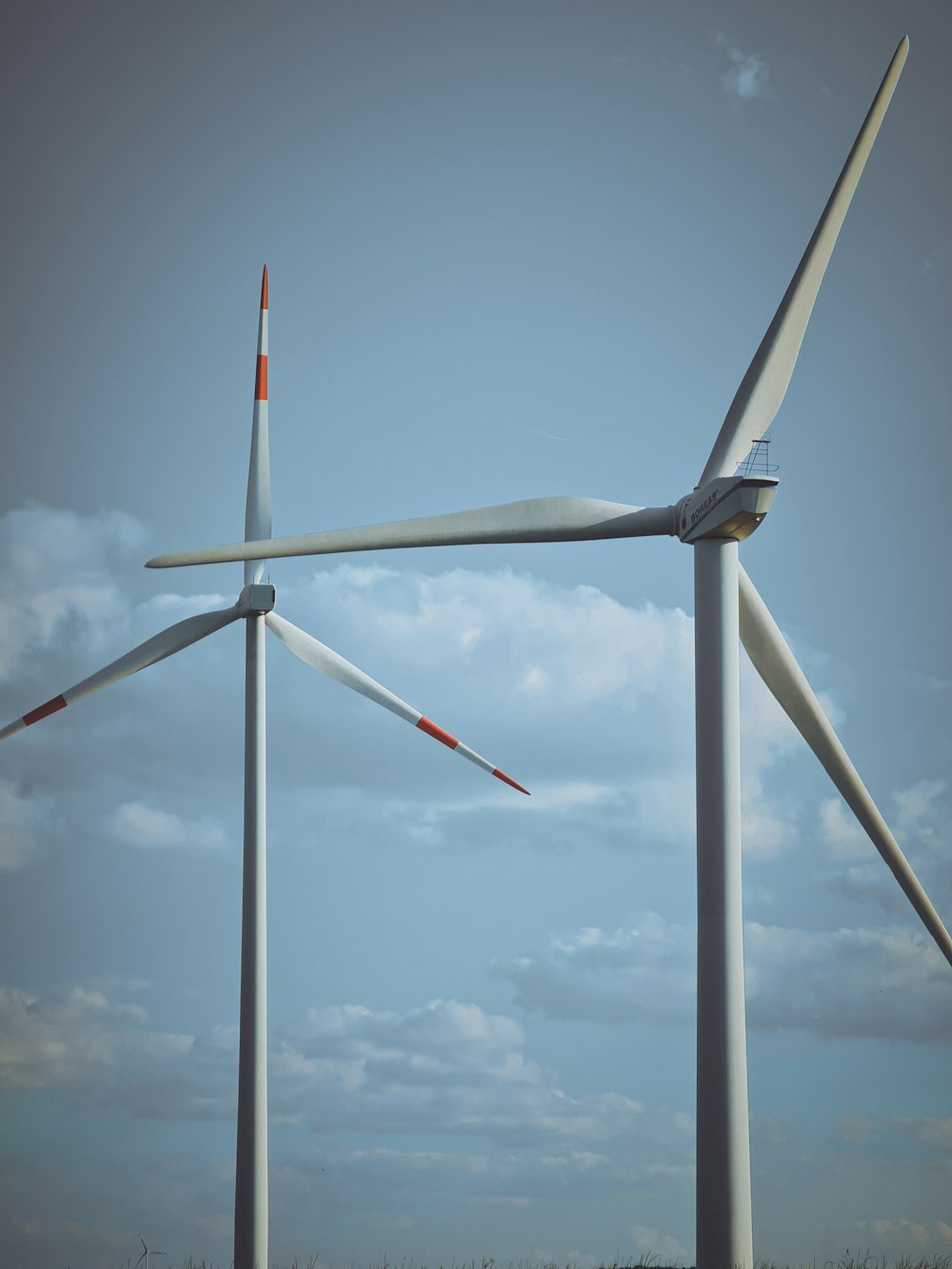 a group of wind turbines in a field