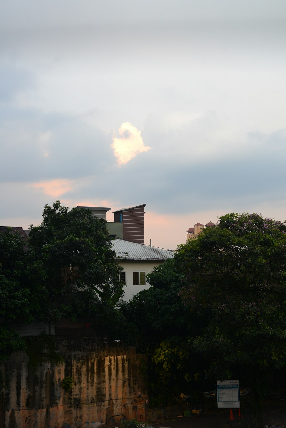 a view of a building with a clock tower in the background