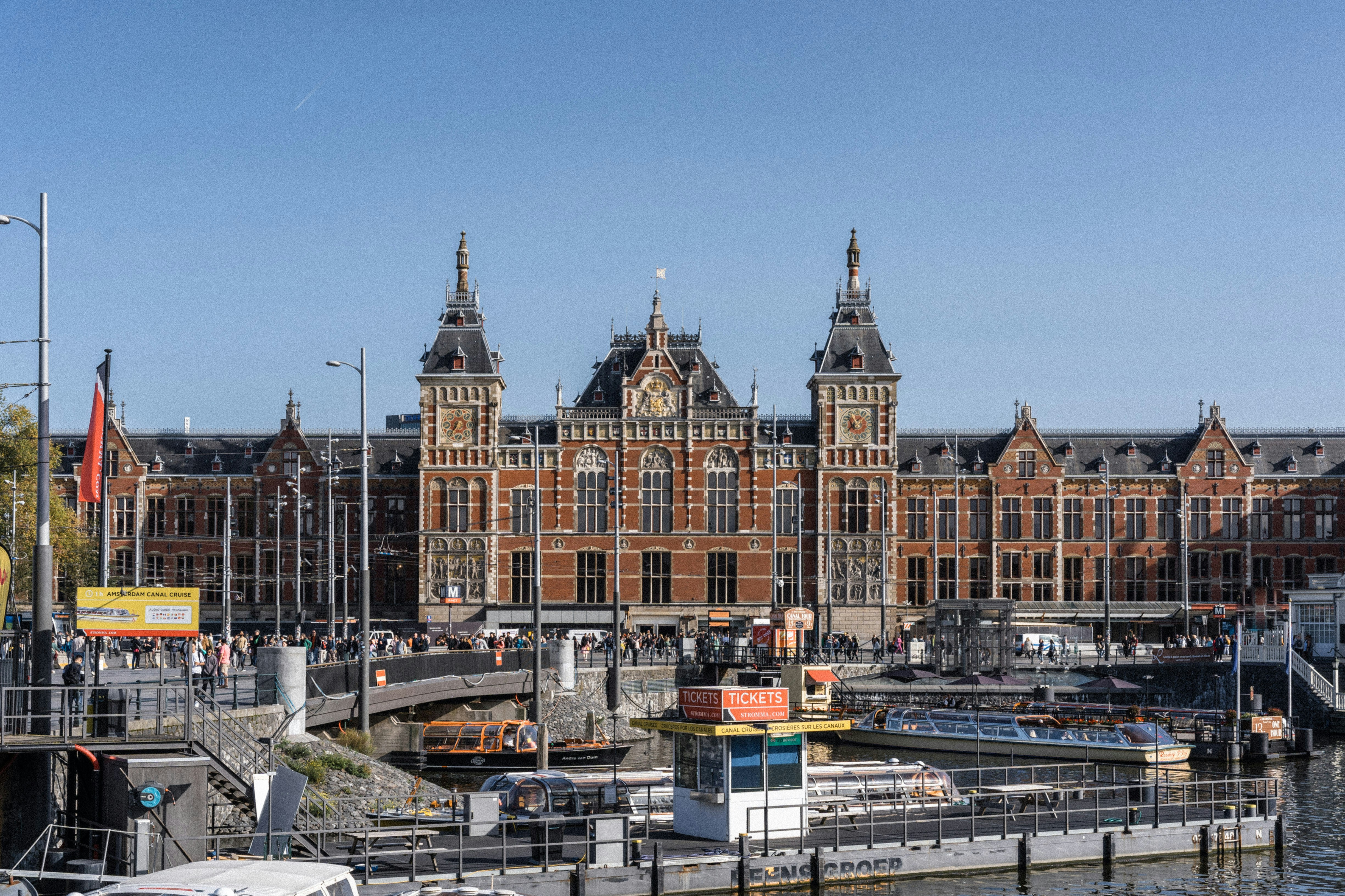 a boat is docked in front of a large building