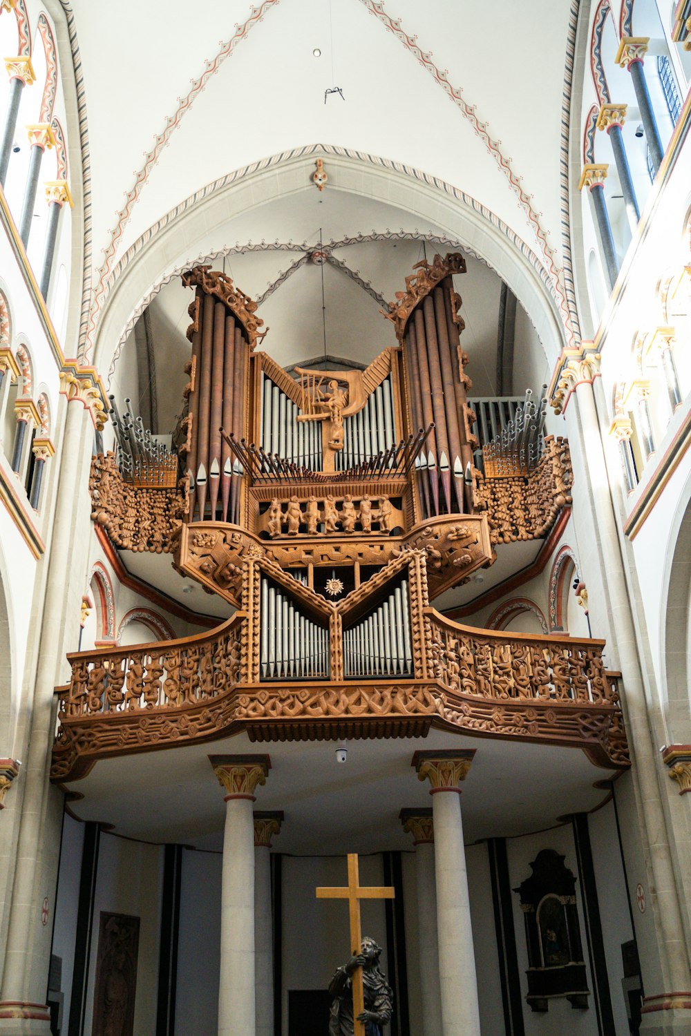 a large wooden pipe organ in a church