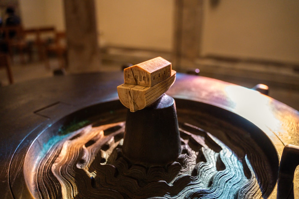 a wooden object sitting on top of a table