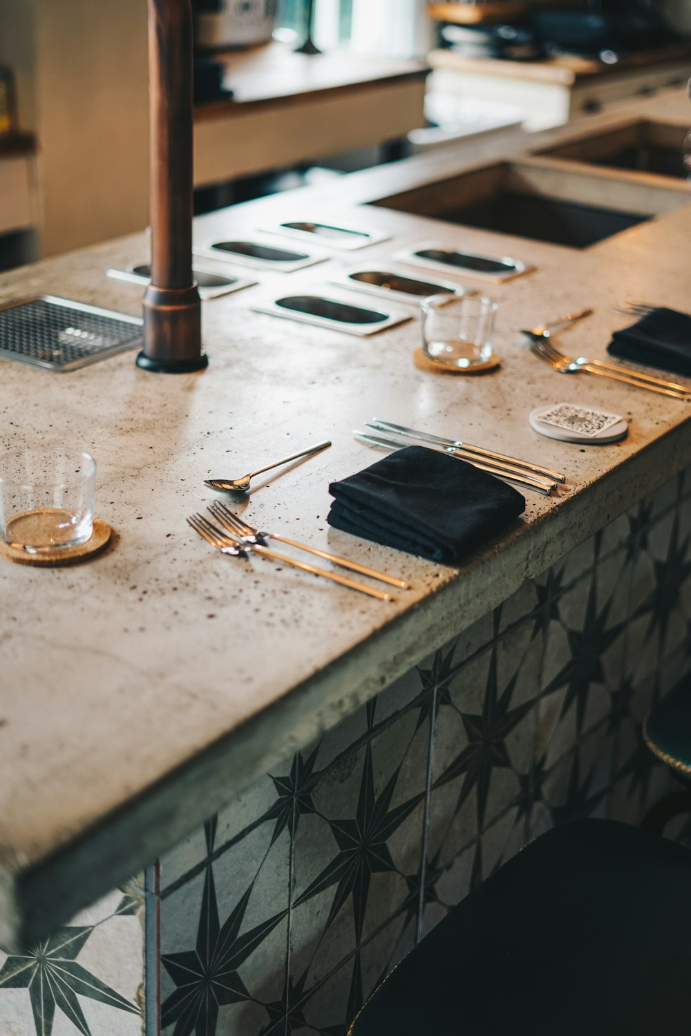 a counter top with a bunch of utensils on it