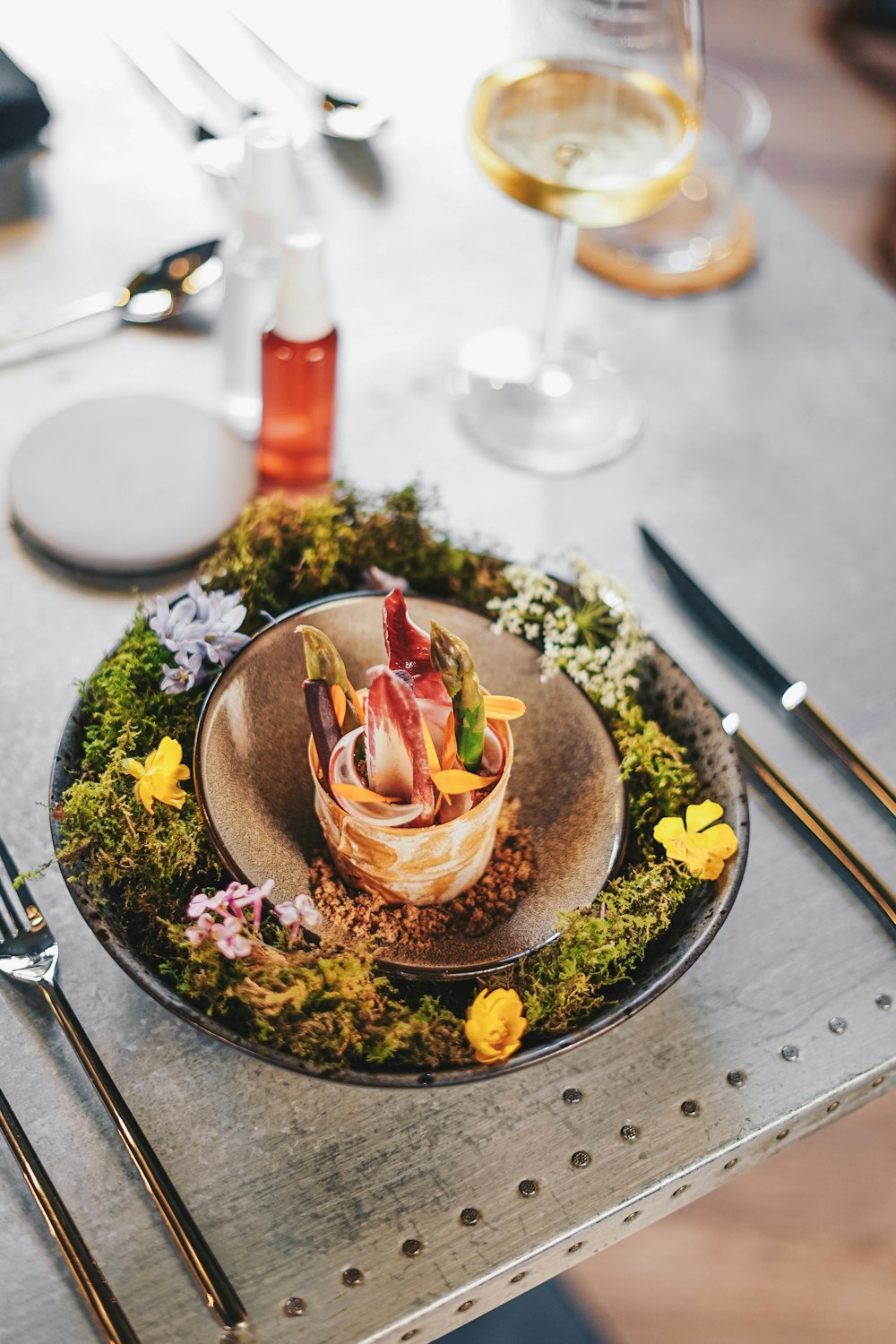 a plate of food on a table with utensils