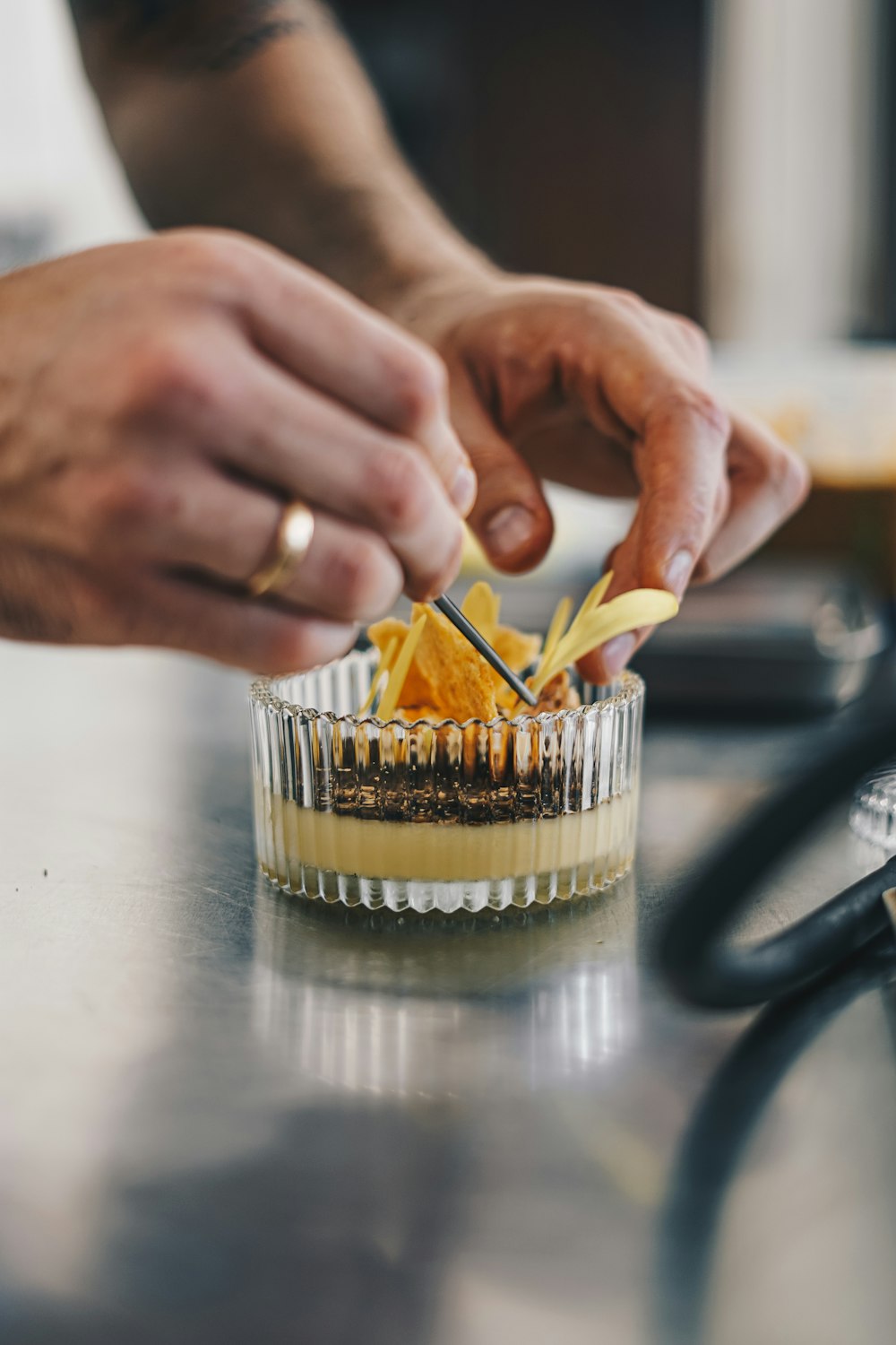 a close up of a person decorating a dessert