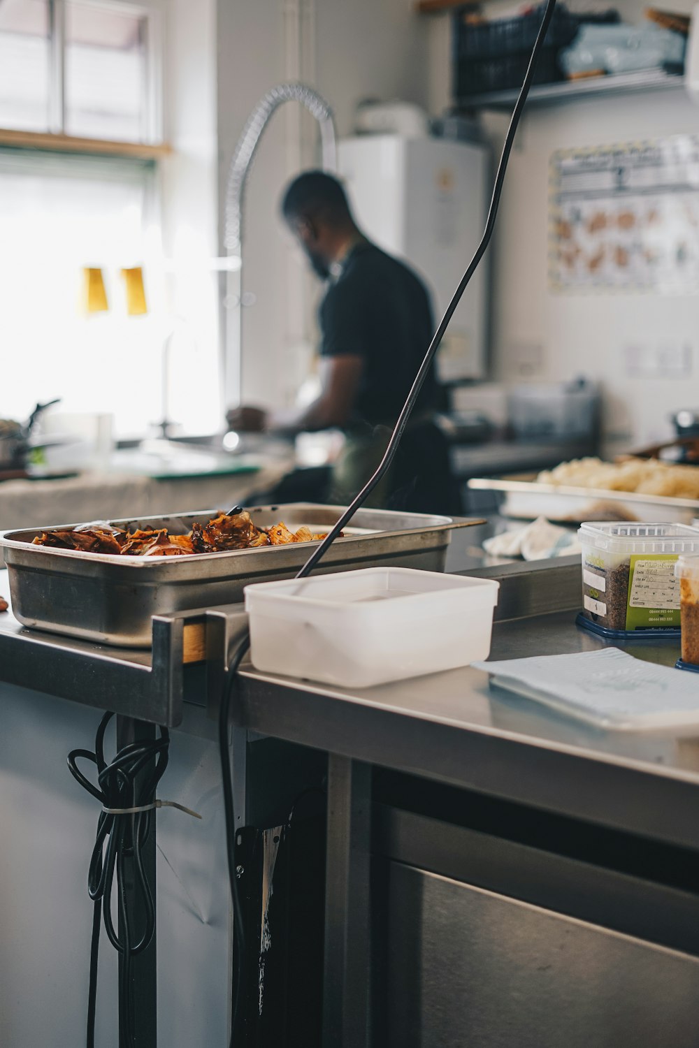 a person in a kitchen preparing food on a counter