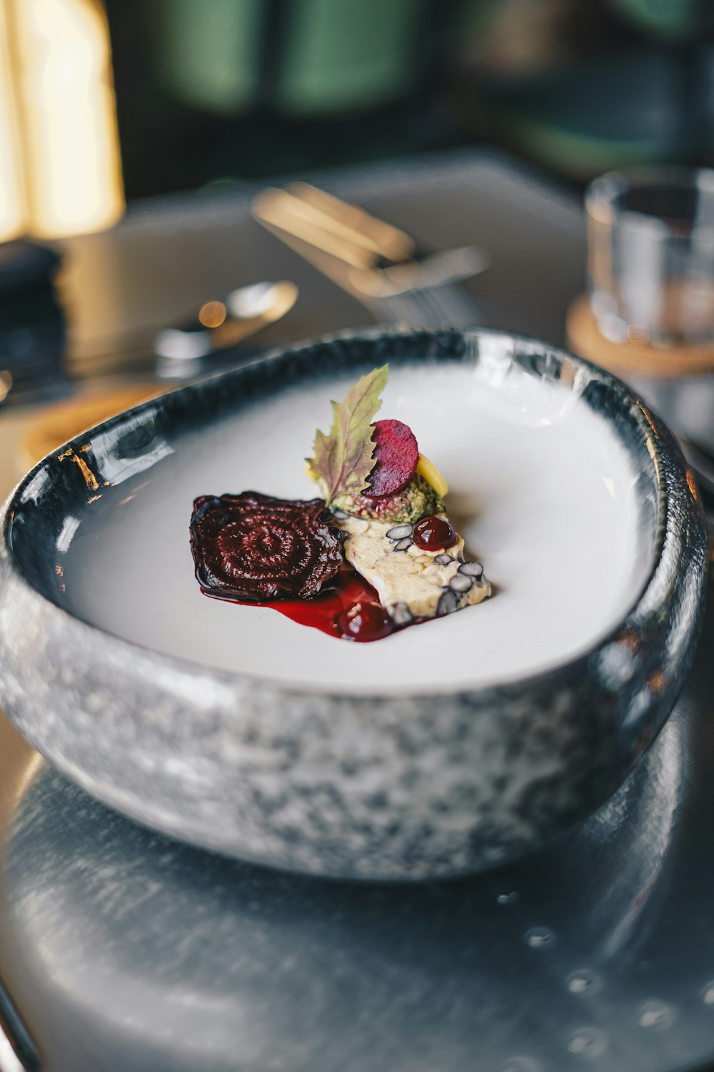 a white plate topped with a dessert on top of a table