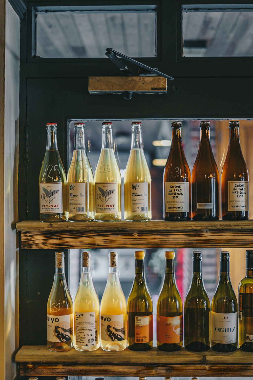 a shelf filled with lots of bottles of wine