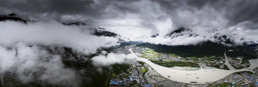 an aerial view of a city surrounded by mountains