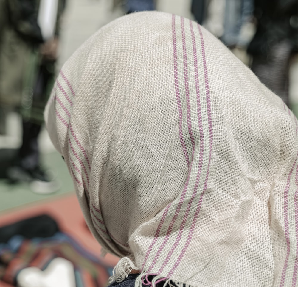 a close up of a person wearing a headscarf