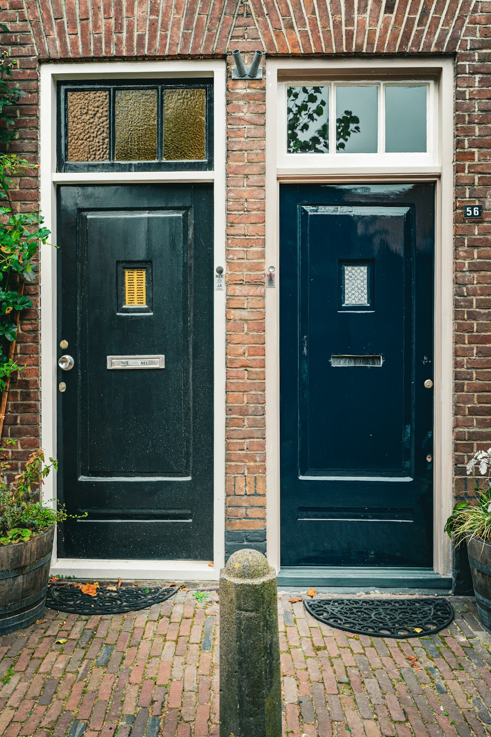 a couple of black doors sitting next to each other