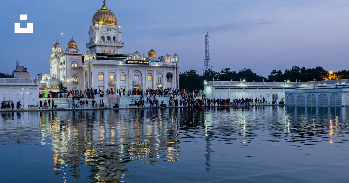 Bangula Building A large white building sitting on top of a lake photo – Free Gurudwara ...