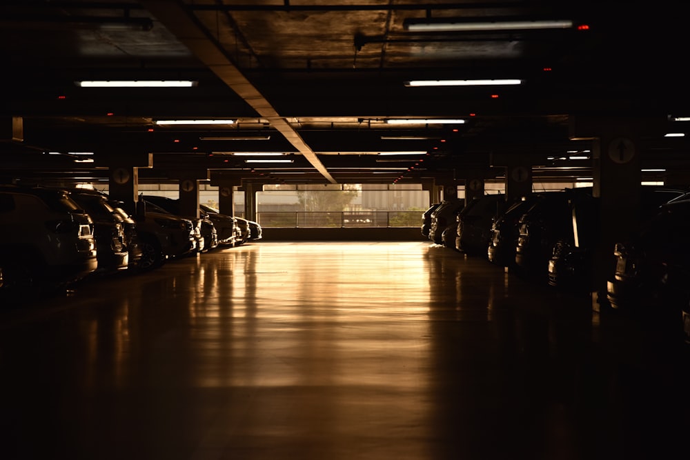 a parking garage filled with lots of parked cars