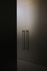 a black and white photo of a tall cabinet
