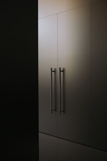 a black and white photo of a tall cabinet