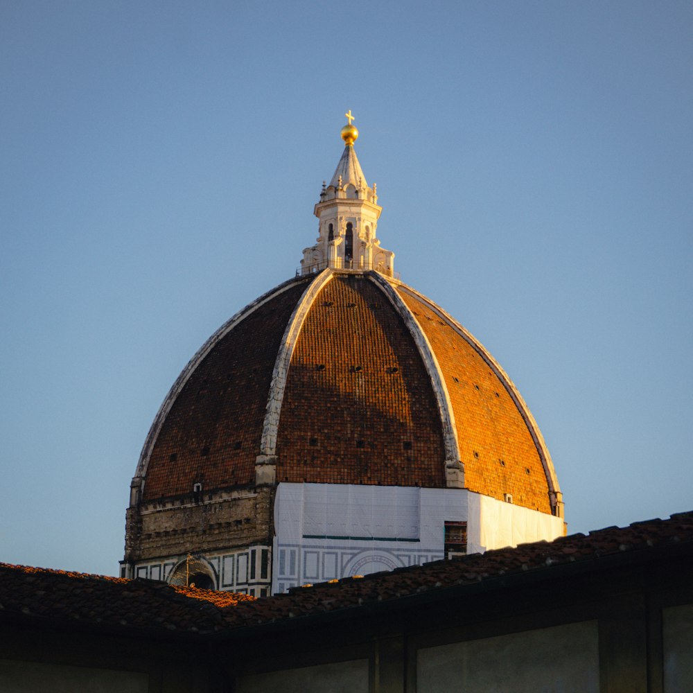 a dome on top of a building with a sky background