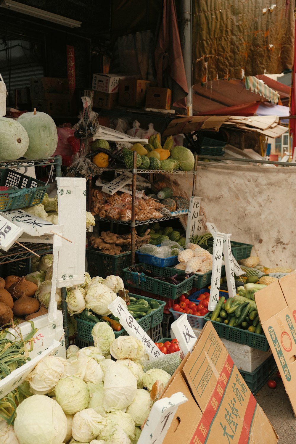 a bunch of fruits and vegetables on display at a market