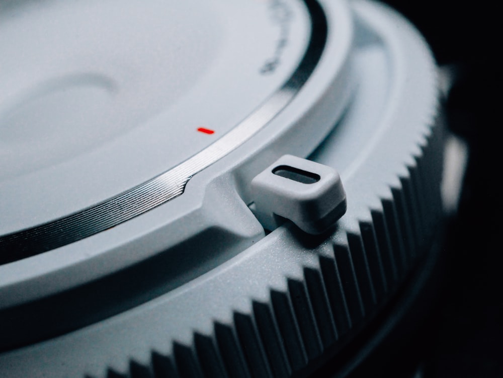 a close up of a record player with a red dot on it