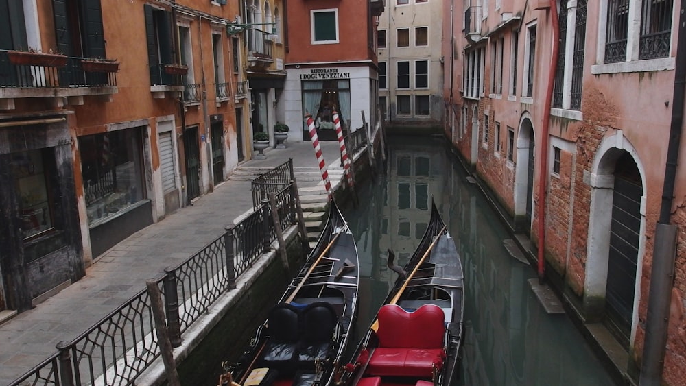 a couple of gondolas that are sitting in the water