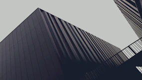 a couple of tall buildings next to each other