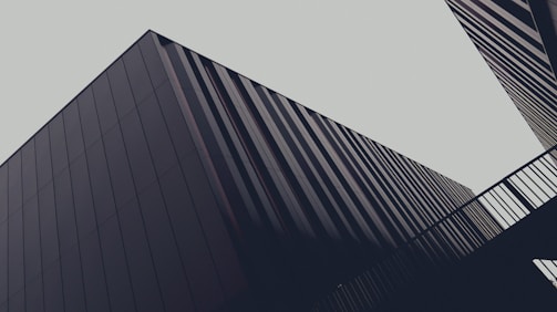 a couple of tall buildings next to each other