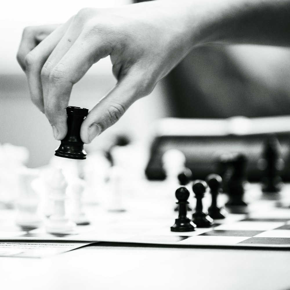 a person is playing a game of chess