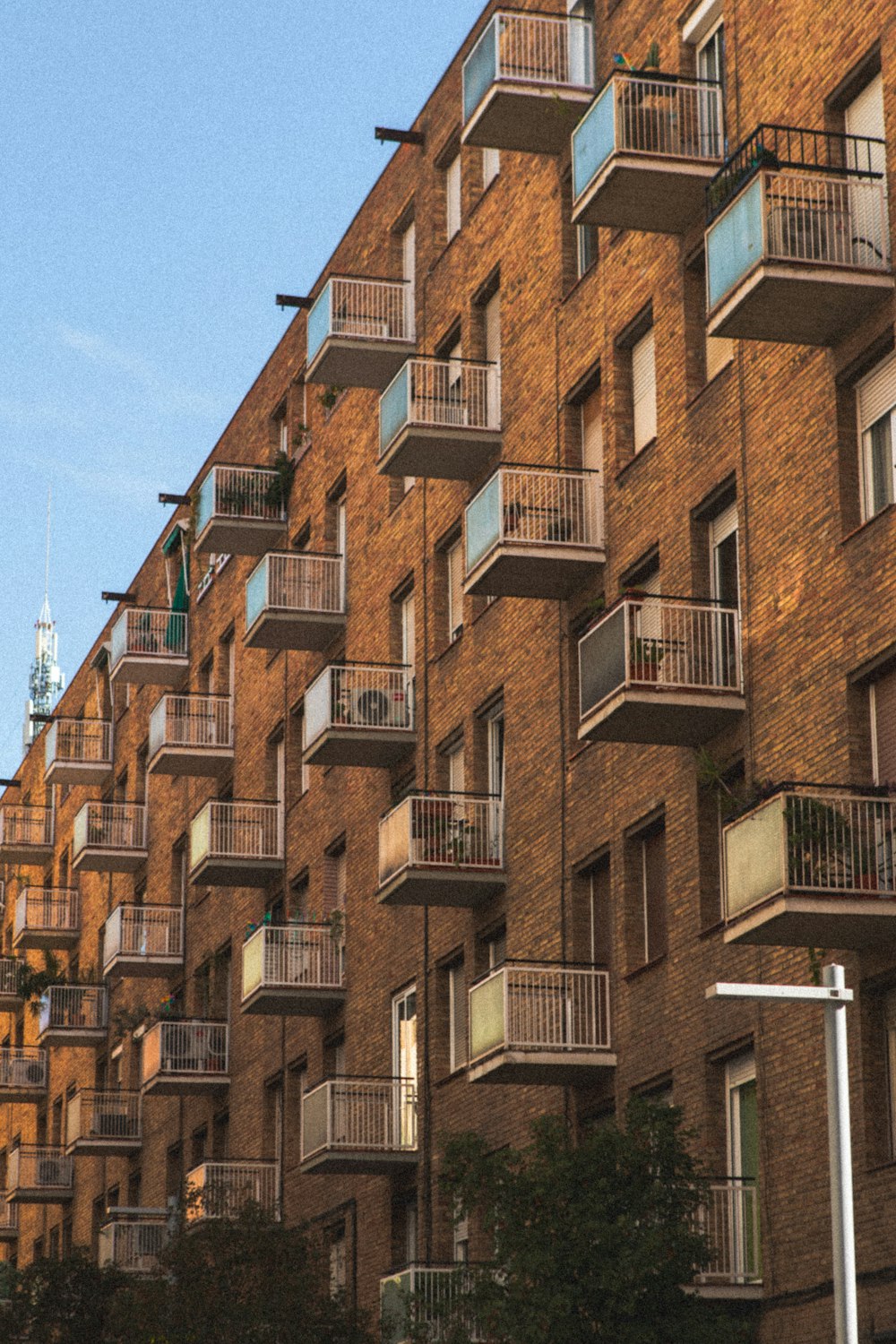 a tall brick building with balconies and balconies on the balcon