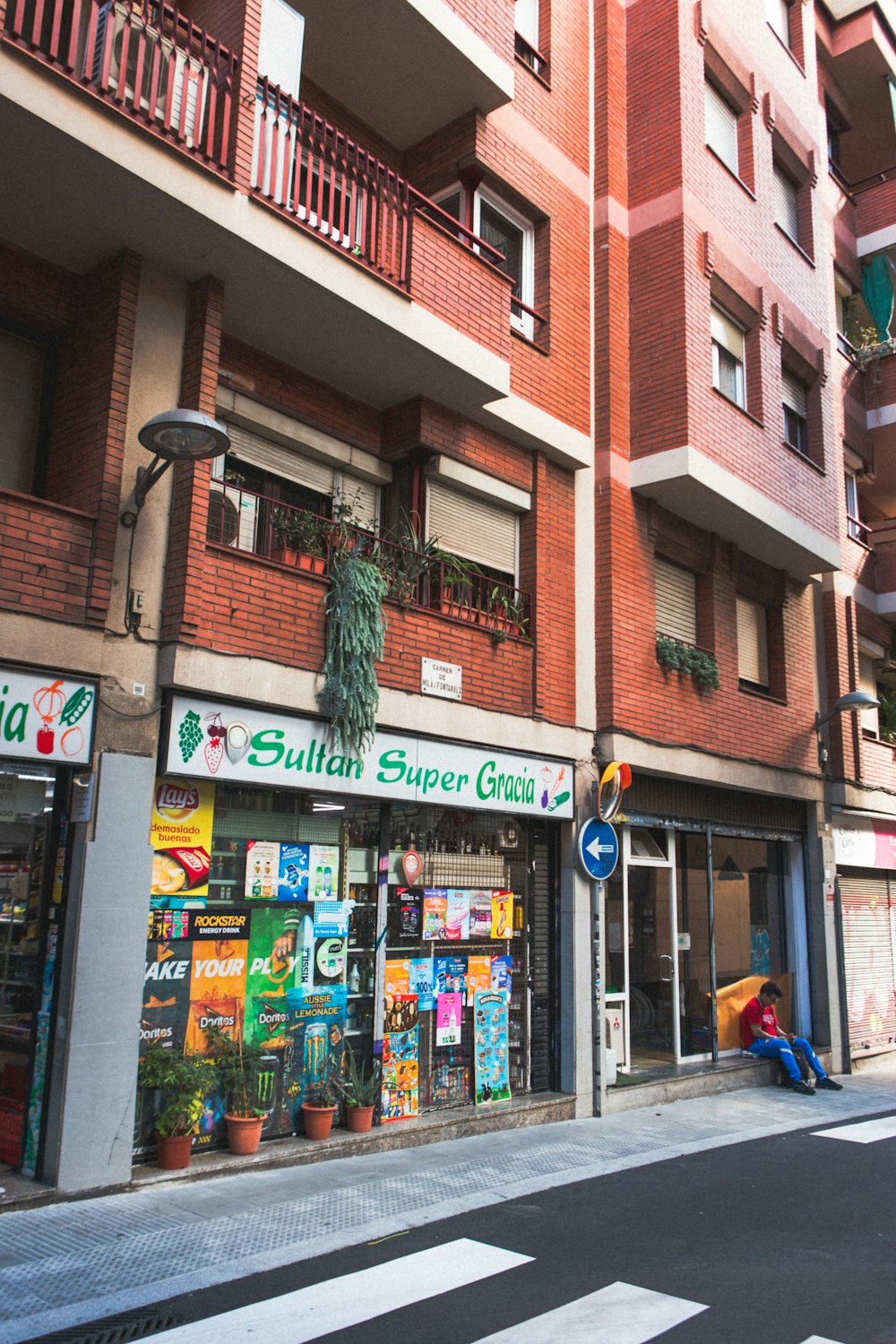 a street corner with a store front and store windows