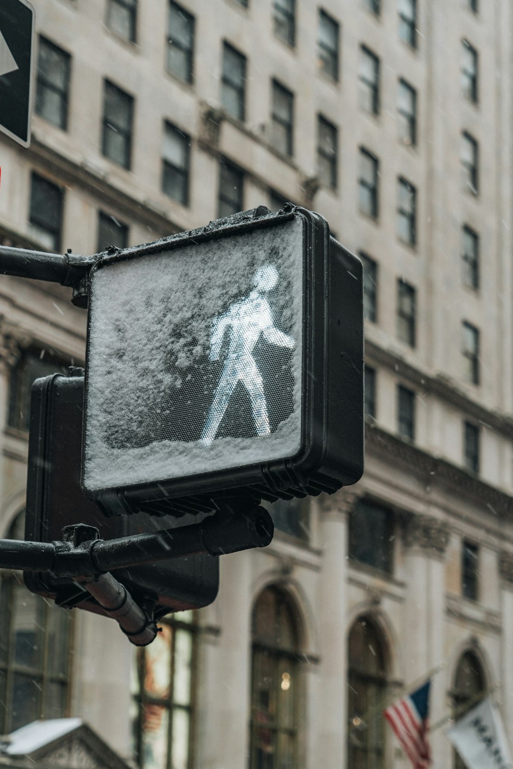 a traffic light with a picture of a person walking