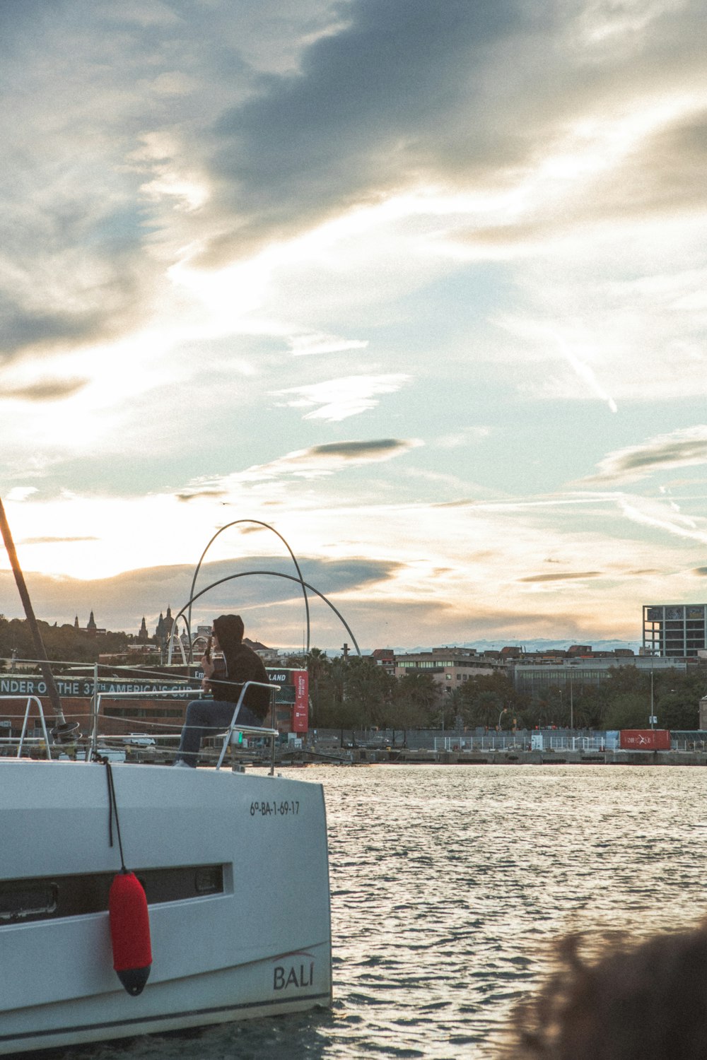 a man standing on a boat in the water