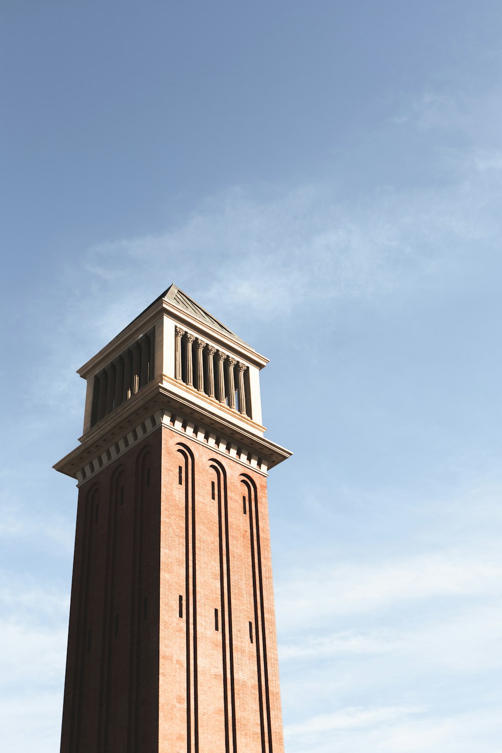 a tall tower with a clock on the top of it