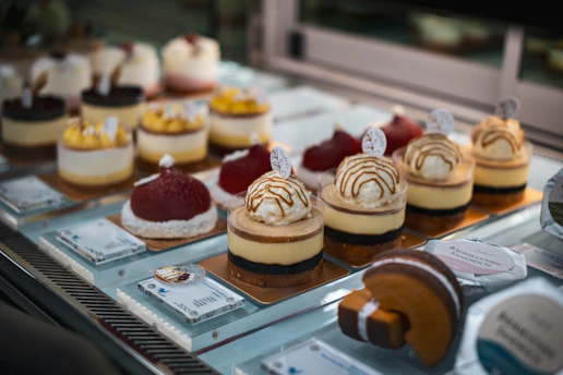 a display case filled with different types of desserts