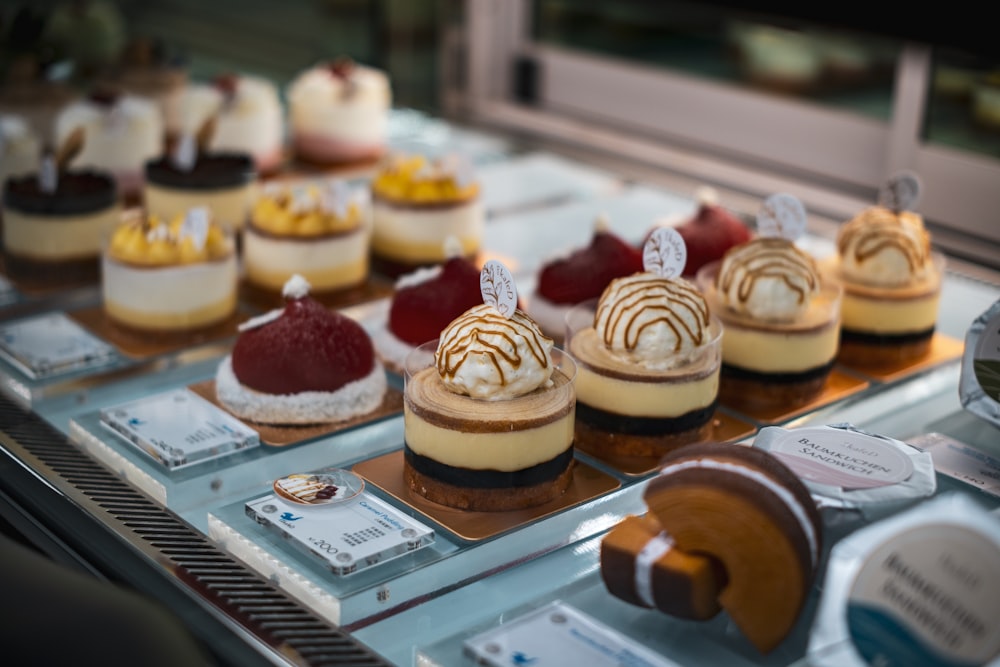 a display case filled with different types of desserts