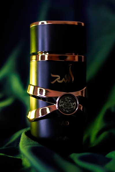 a gold and black stack of rings on a green cloth