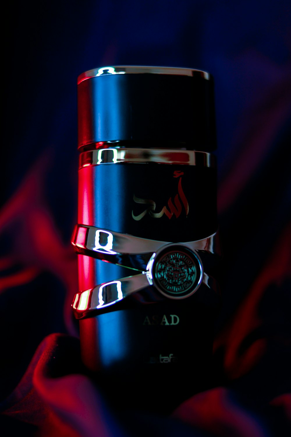 a close up of a red and black lighter