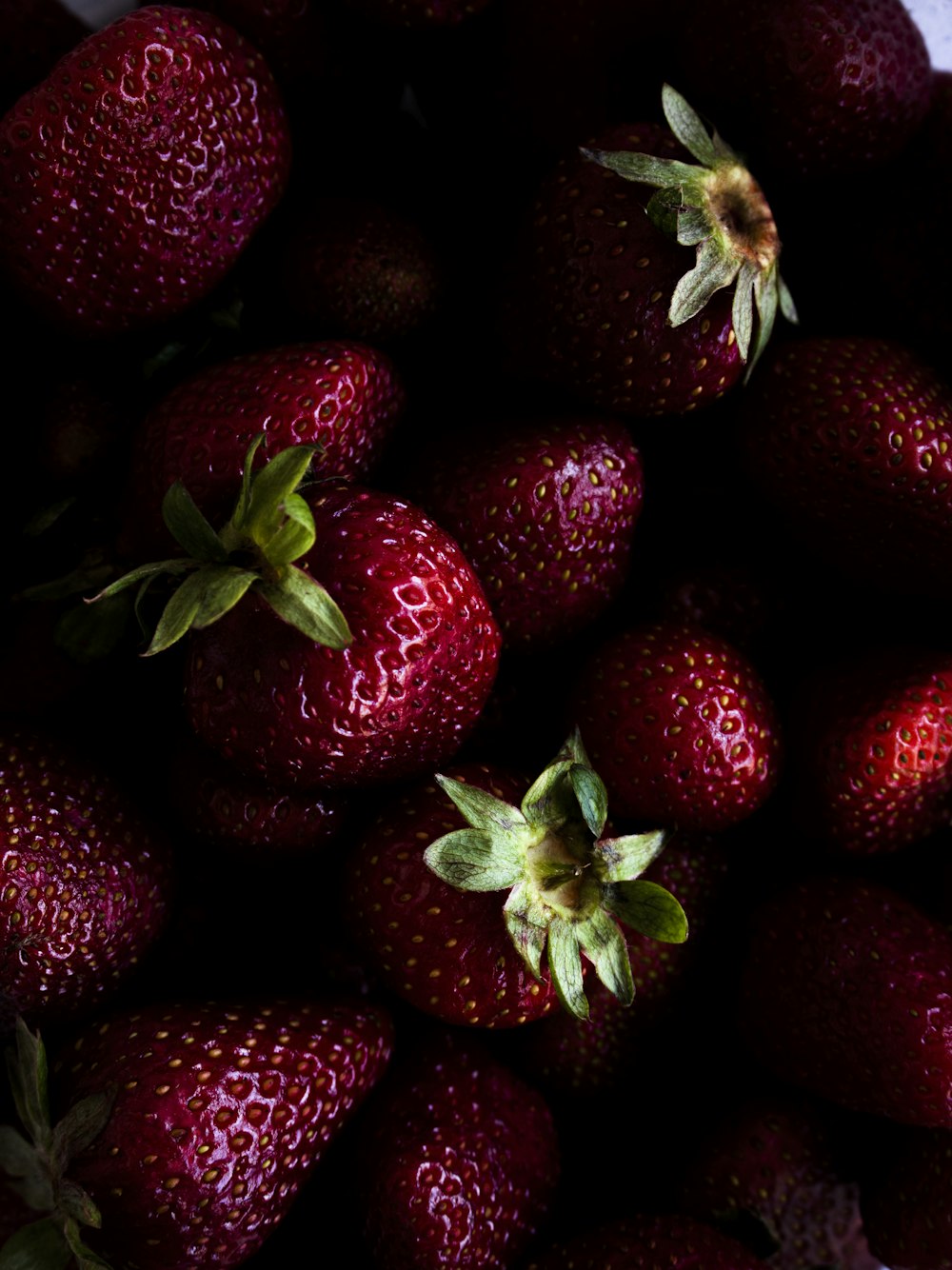 a close up of a bunch of strawberries